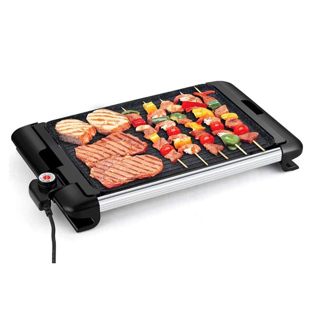 a grill with meat and vegetables on it